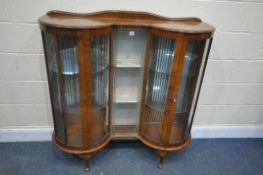 A 20TH CENTURY WALNUT BURGET VIL DISPLAY CABINET, with two glazed doors, flanking a central glazed