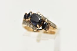 A 9CT GOLD SAPPHIRE AND DIAMOND DRESS RING, set with an oval dark sapphire and marquise sapphire (