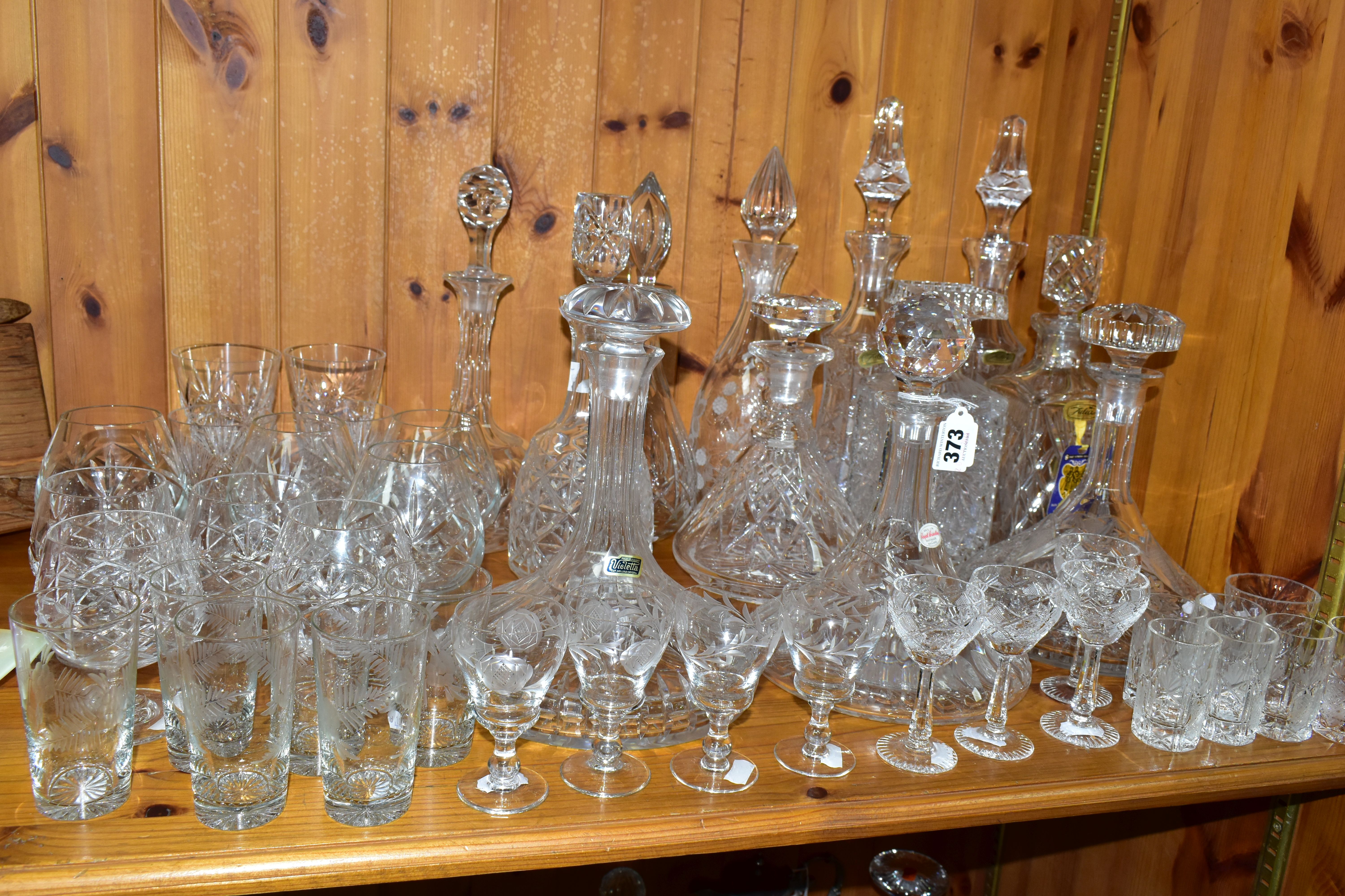 A COLLECTION OF CUT CRYSTAL AND OTHER GLASSWARES, over forty pieces to include twelve decanters: