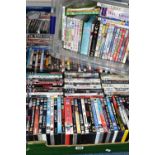 FOUR BOXES OF DVDS, approximately one hundred and eighty DVDs, mainly feature films, with some TV