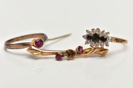 TWO RINGS AND A BROOCH, the first a cluster ring set with three graduated circular cut blue