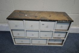 A SMALL 19TH CENTURY PAINTED PINE CARPENTERS CABINETS, made up of eleven drawers, width 76cm x depth