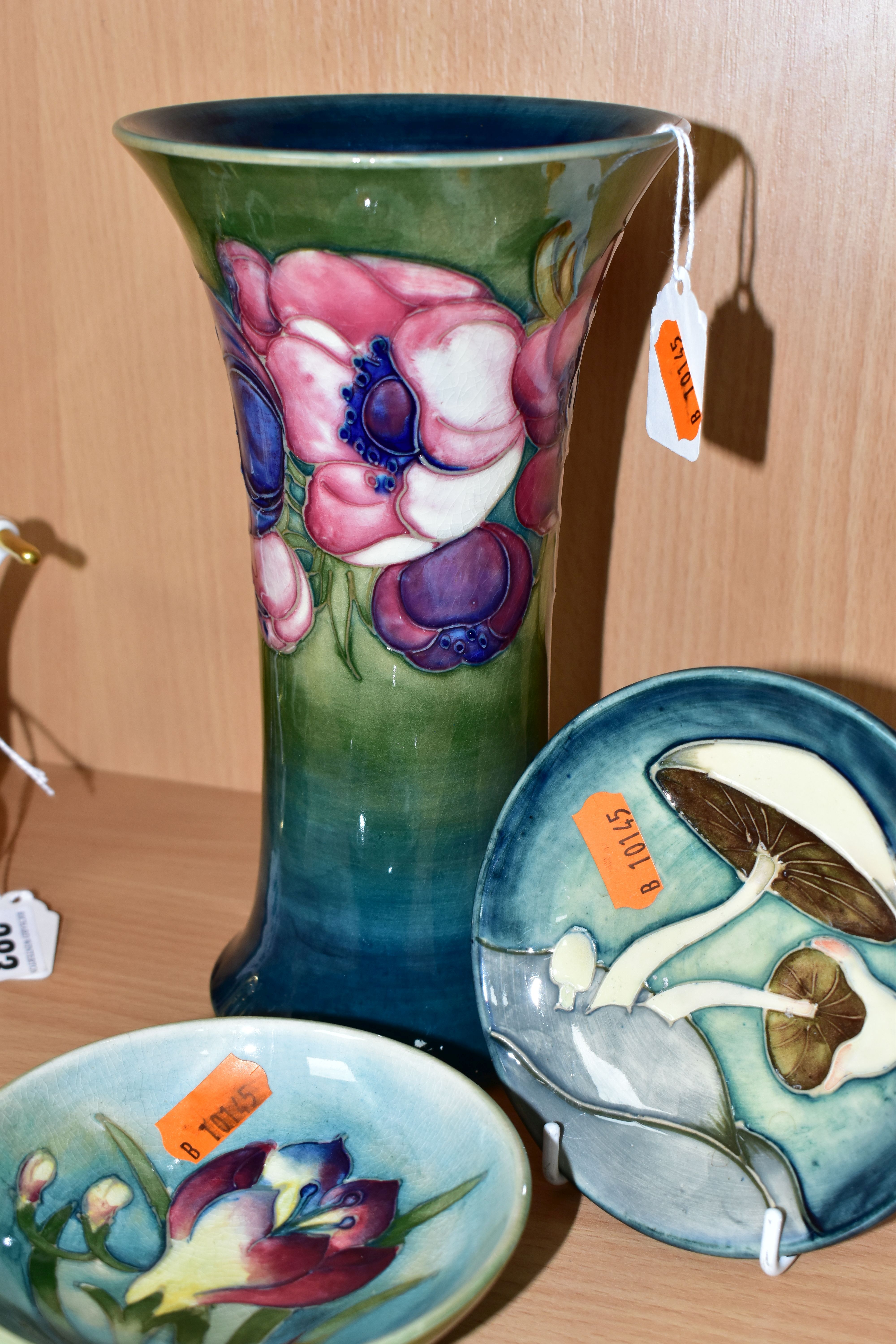THREE PIECES OF MOORCROFT POTTERY, comprising an Anemones pattern vase of flared form, tubelined - Image 3 of 4