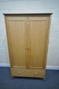 A LIGHT OAK ERCOL TERAMO WARDROBE, with two doors, above a single drawer, model number 2686, width