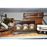 A GROUP OF VINTAGE SUITCASES, comprising three large brown suitcases, a cream vanity case, black