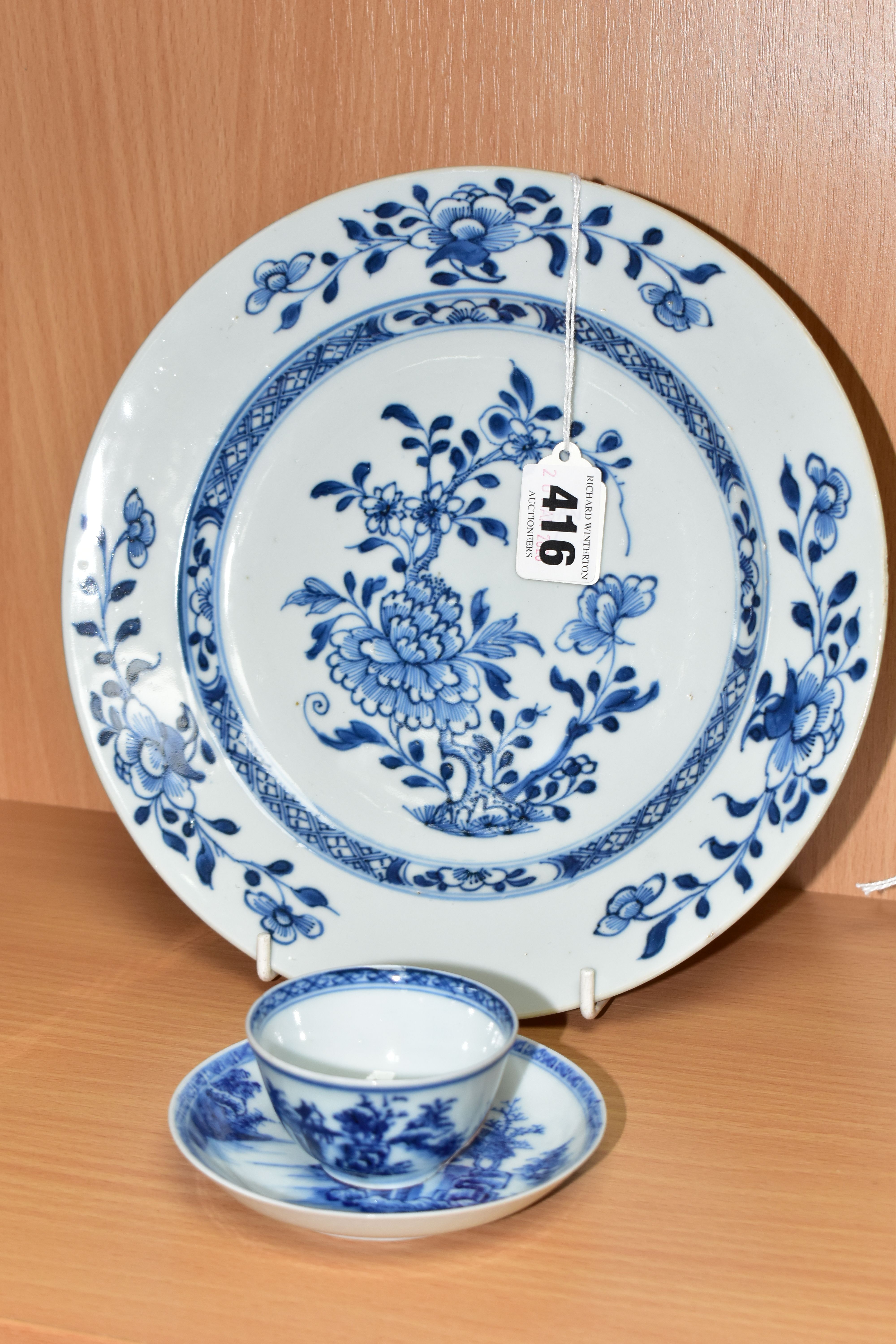A 'THE NANKING CARGO' BLUE AND WHITE PORCELAIN TEA BOWL, SAUCER AND PLATE, the tea bowl and saucer