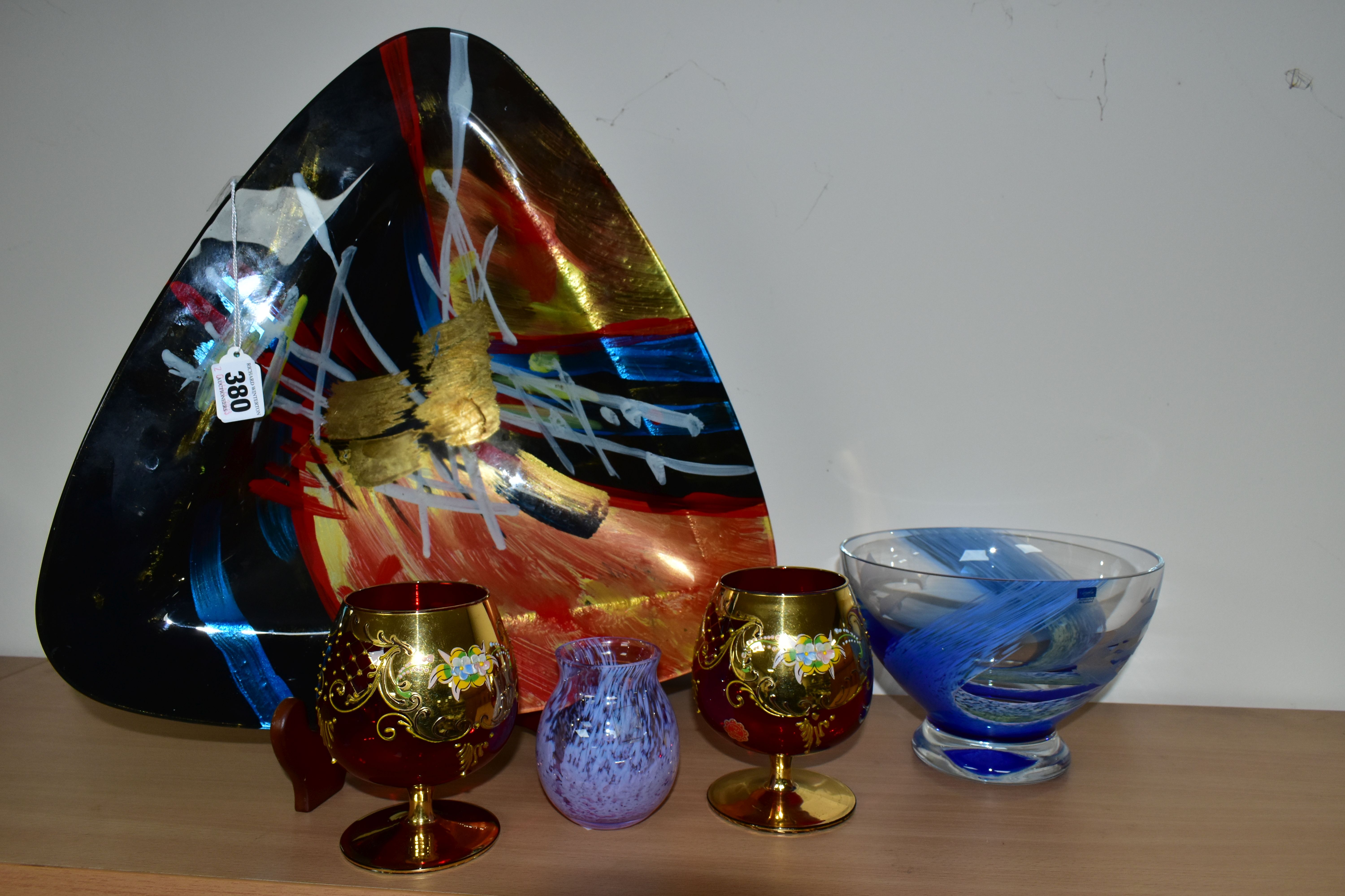 A GROUP OF GLASSWARES, comprising a large triangular reverse painted bowl, of multicoloured,