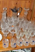 A GROUP OF CUT CRYSTAL GLASSWARES, thirty four pieces, to include a claret jug having plated
