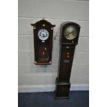 AN OAK GRANDDAUGHTER CLOCK, with winding key (condition:-missing glass panel) and a mahogany wall