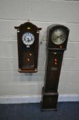 AN OAK GRANDDAUGHTER CLOCK, with winding key (condition:-missing glass panel) and a mahogany wall