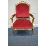 A FRENCH LOUIS XVI STYLE GILT WOOD CHAIR, with open armrests, and red fabric, width 66cm x depth