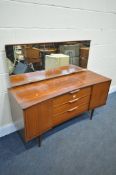 A MID-CENTURY TEAK DRESSING TABLE, with a rectangular mirror, and three central drawers, on square