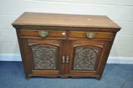 A 20TH CENTURY WALNUT DRESSER BASE, with two drawers, above two cupboard doors, with foliate