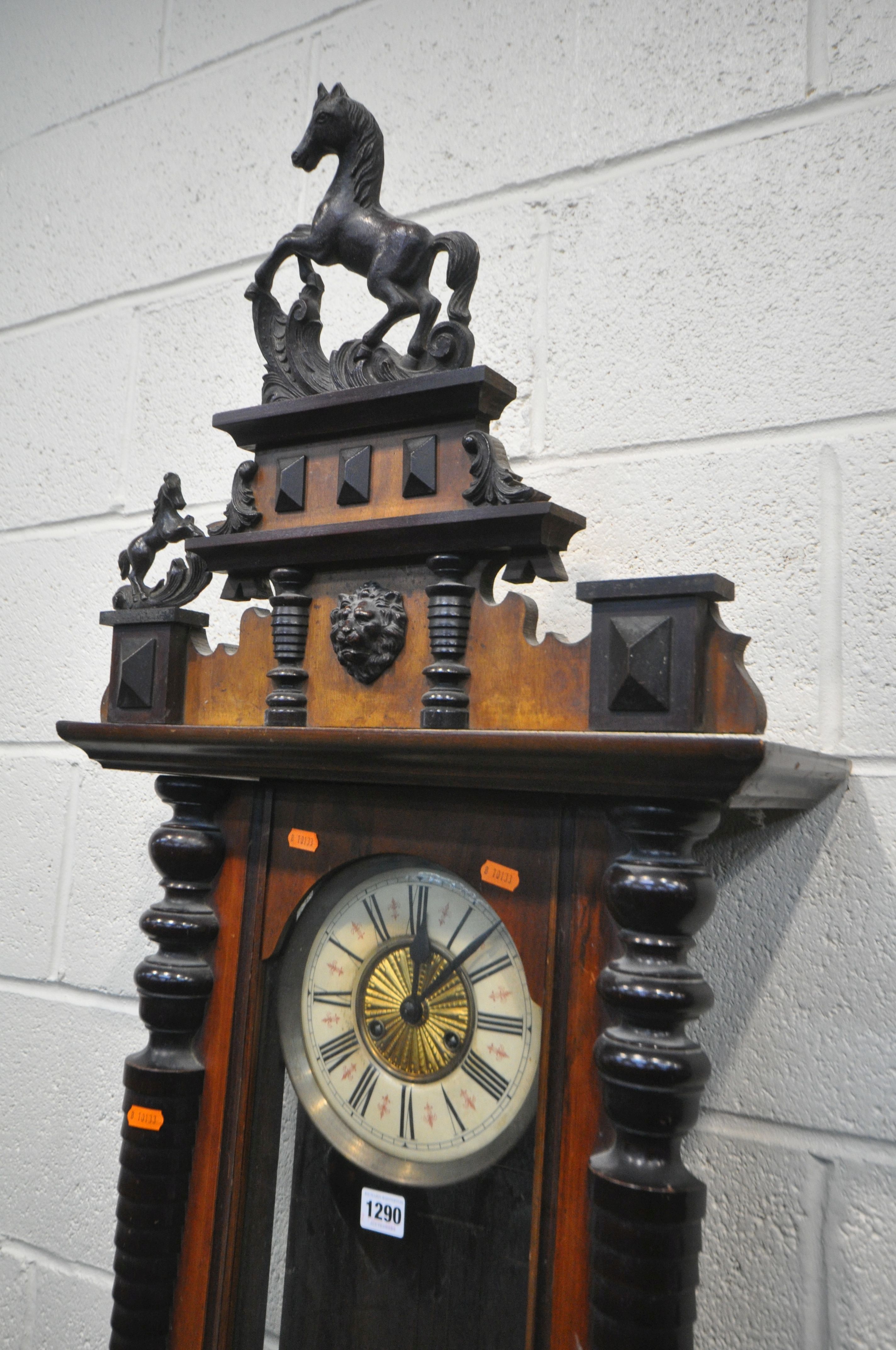 A LATE 19TH CENTURY WALNUT VIENNA WALL CLOCK, with two carved horse pediments, enamel dial with - Image 2 of 5