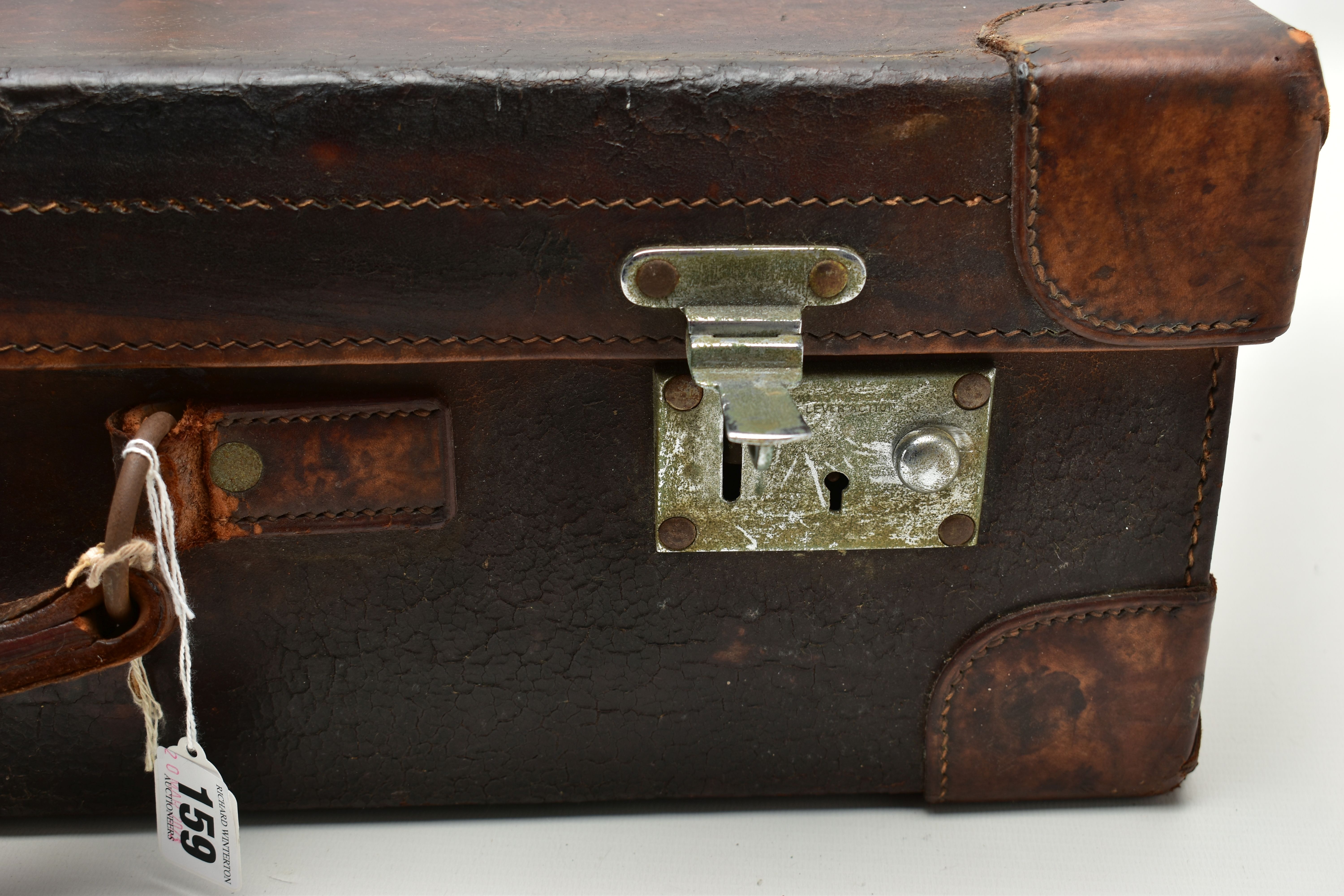 AN EARLY 20TH CENTURY BROWN LEATHER DRESSING SUITCASE IN WORN CONDITION, containing five silver - Image 3 of 9