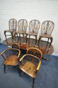 A SET OF FOUR ELM AND BEECH WHEEL BACK CHAIRS, with a crinoline stretcher, two 19th century