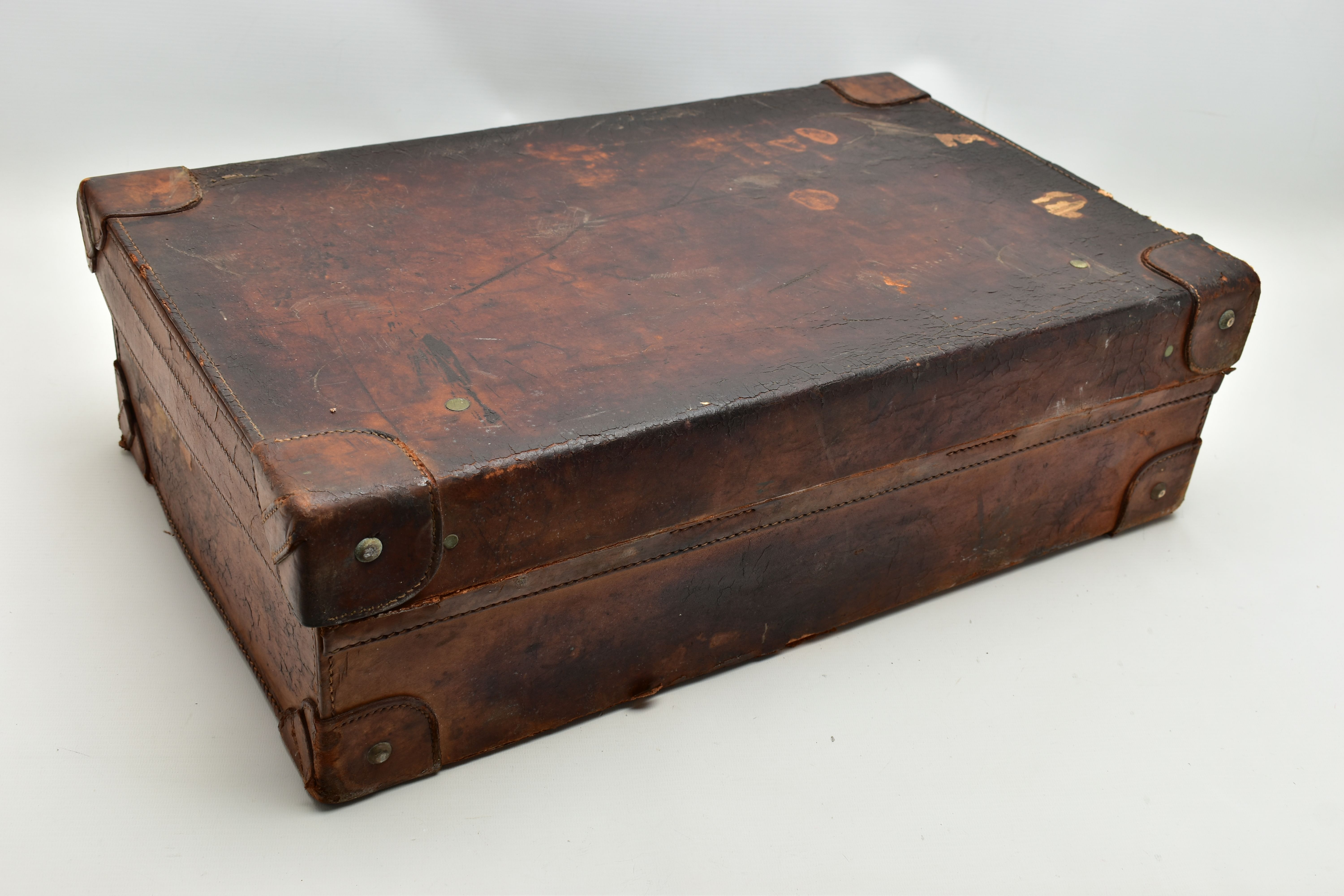 AN EARLY 20TH CENTURY BROWN LEATHER DRESSING SUITCASE IN WORN CONDITION, containing five silver - Image 9 of 9