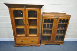 A HARDWOOD GLAZED TWO DOOR BOOKCASE, with two shelves, and a single drawer, width 105cm x depth 40cm