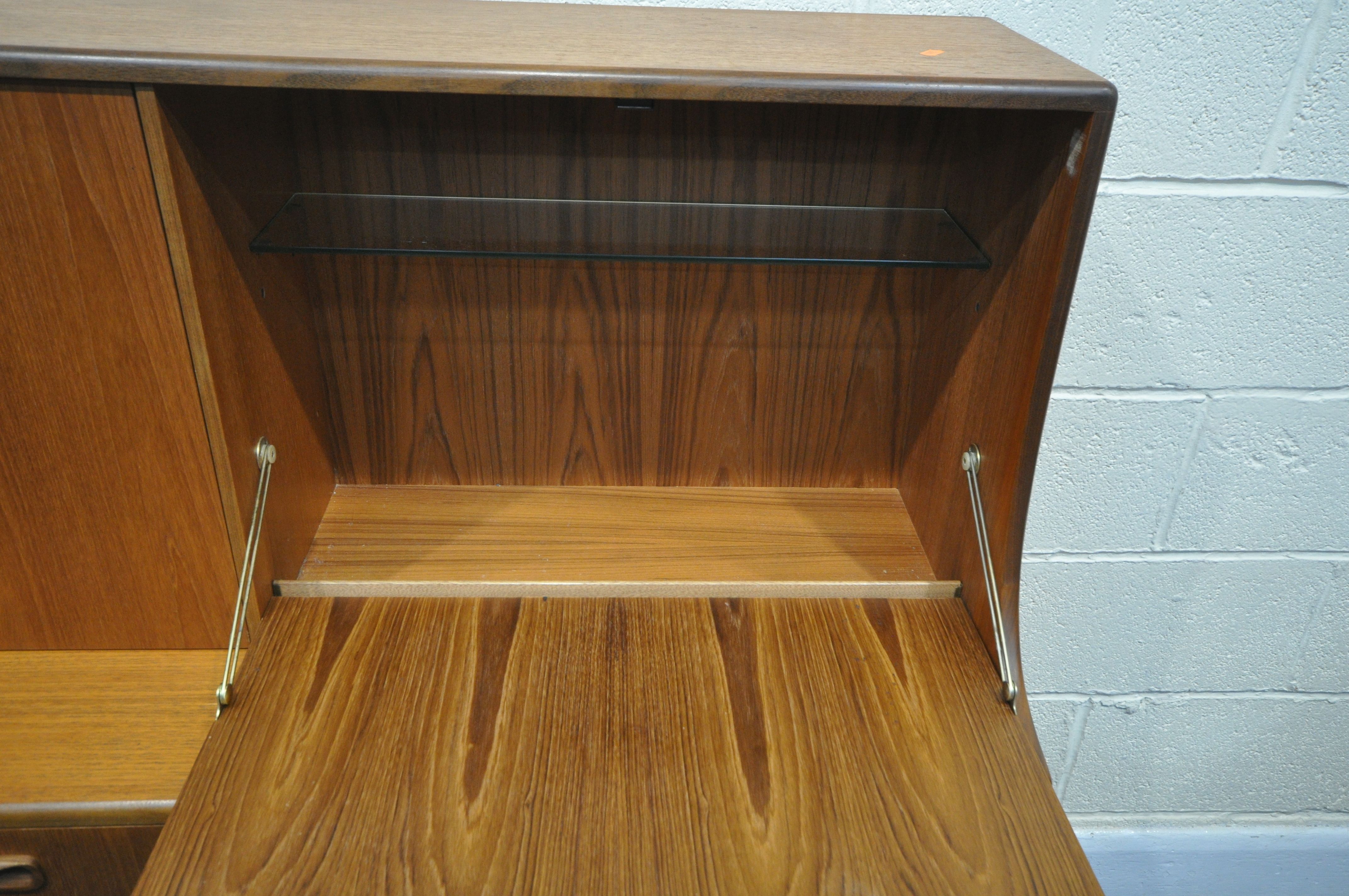 A MID CENTURY G PLAN FRESCO TEAK HIGHBOARD, upper section with a sliding door, and fall front - Image 4 of 7