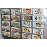 TWO ALBUMS OF CIGARETTE CARDS containing approximately 1124 cards in complete sets, part sets and '