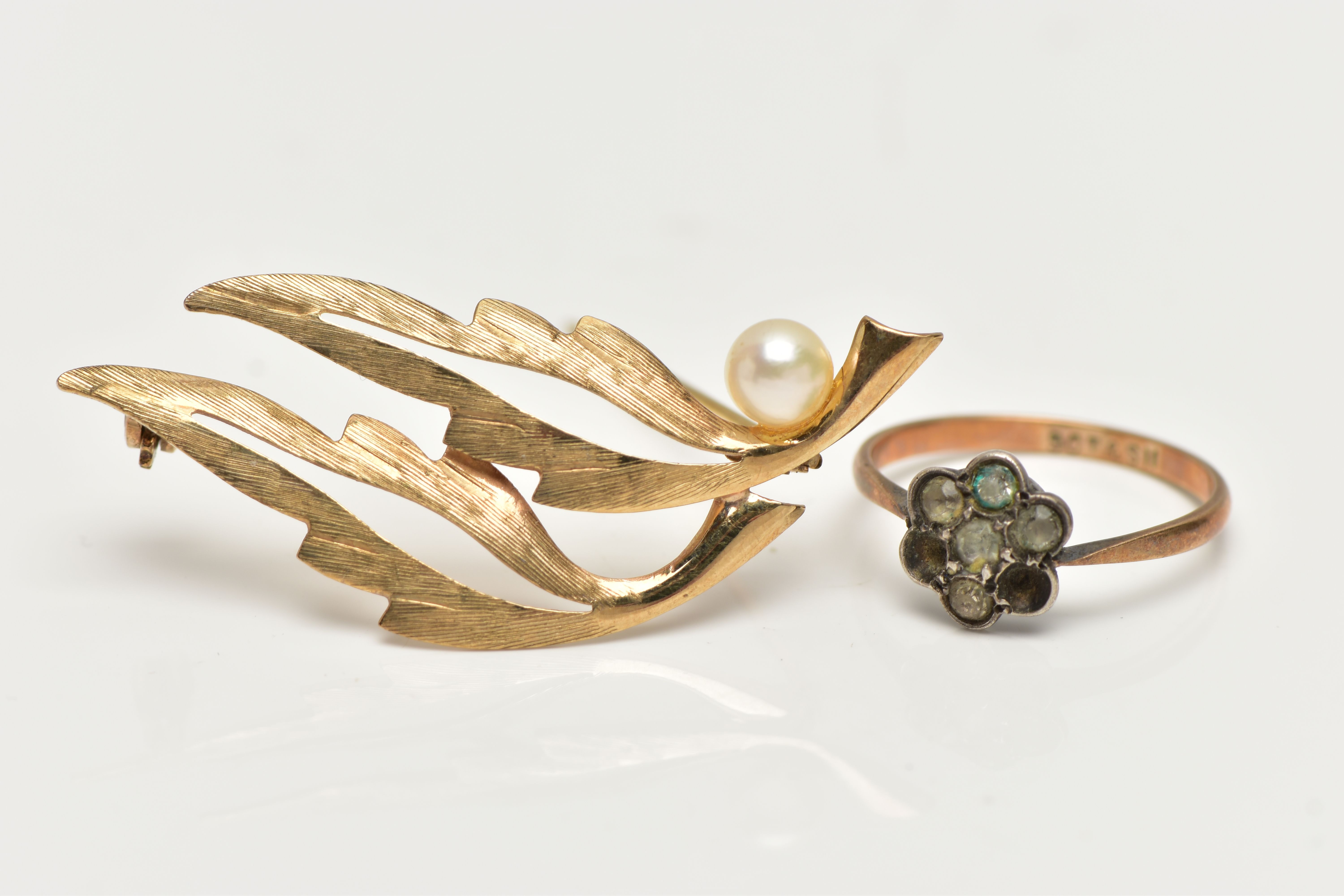 A 9CT GOLD BROOCH AND A RING, openwork leaf brooch set with a single cultured pearl, fitted with a