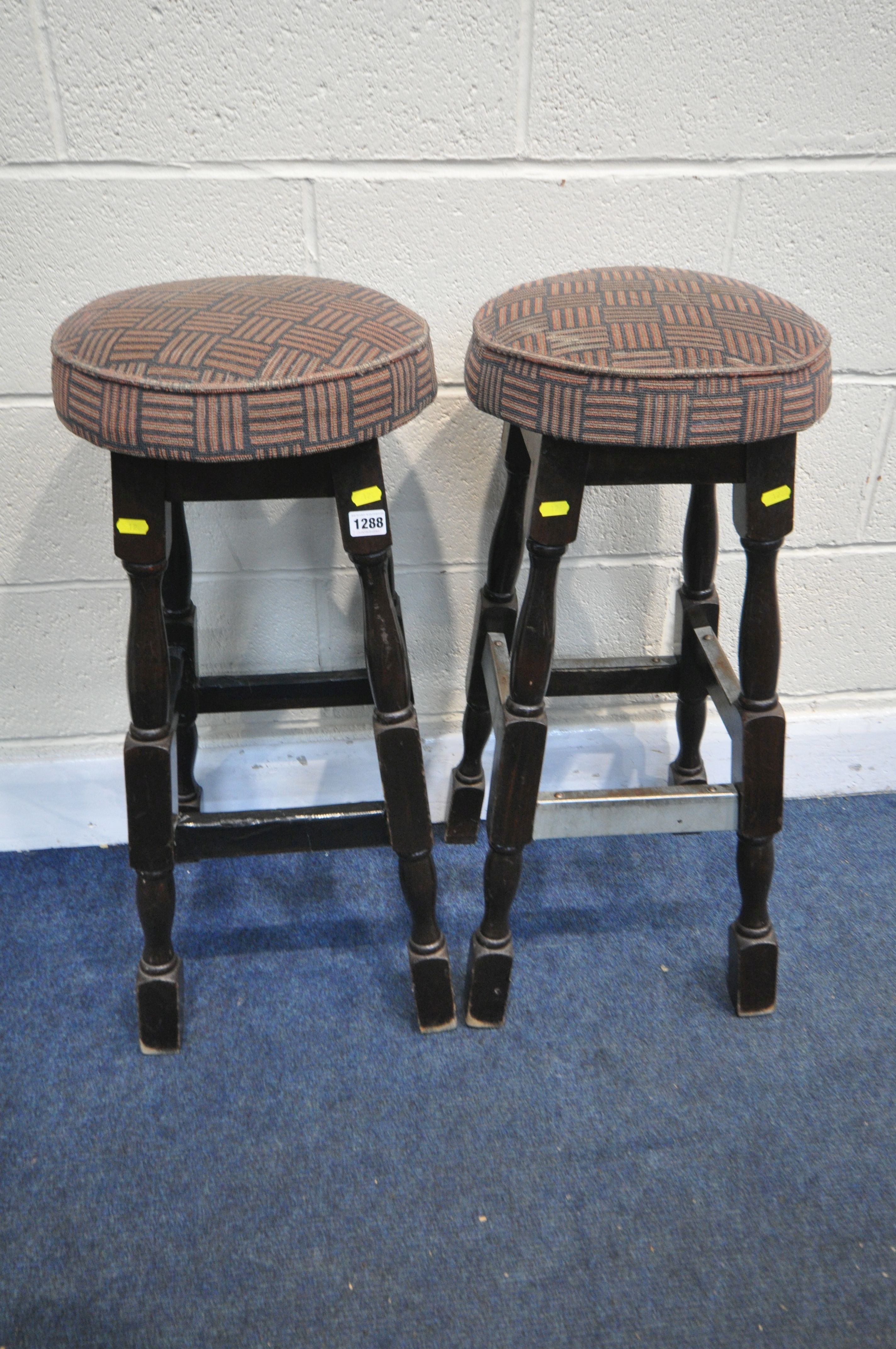 A PAIR OF 20TH CENTURY PUB STOOLS, height 77cm (condition - worn upholstery, heavily stained, one
