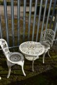A PAINTED CAST IRON CIRCULAR GARDEN TABLE, diameter 61cm x height 55cm, and two chairs (condition:-