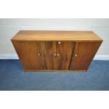 A HARDWOOD FOUR DOOR CUPBOARD, length 137cm x depth 39cm x height 78cm (condition - surface marks,