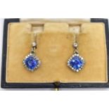 A PAIR OF EARLY 20TH CENTURY SAPPHIRE AND DIAMOND EARRINGS, each earring set with a cushion cut