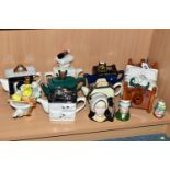 A COLLECTION OF NOVELTY TEAPOTS AND CHARACTER JUGS, comprising eight novelty teapots in the forms of