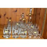 A SET OF KOSTA BODA PIPPI DESIGN GLASSWARE AND DECANTERS, comprising two decanters, a set of six