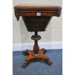 A VICTORIAN ROSEWOOD WORK TABLE, the lid enclosing a pink fitted interior, blind fretwork detail, on