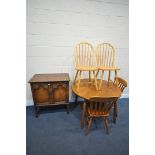 A PINE CIRCULAR KITCHEN TABLE, diameter 105cm x height 73cm, two pine kitchen chairs, two beech