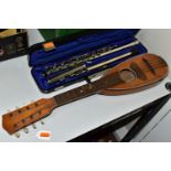 AN OTTO GROH TRAVEL MANDOLIN, an Evette flute with pitted chrome finish and case and a box