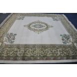 A X LARGE ORIENTAL WOLLEN RUG, cream and green ground, with a central medallion, 456cm x 368cm (