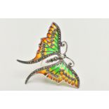 A WHITE METAL PLIQUE A JOUR BROOCH, in the form of butterfly with red, green and yellow enamel