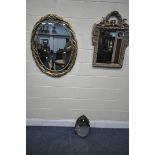 AN LATE 2OTH CENTURY GILT FRAMED OVAL WALL MIRROR, 76cm x 98cm, a foliate framed wall mirror with