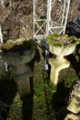 A PAIR OF WEATHERED ACANTHUS LEAF PLANTERS, on a separate plinth, diameter 48cm x height 89cm x