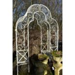 AN ARCHICTURAL WROUGHT IRON GARDEN ROSE ARBOUR, with a seat at each end, width 170cm x depth 93cm