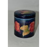 A MOORCROFT POTTERY POMEGRANATE COVERED JAR, of cylindrical form, tube lined with pomegranates and
