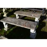 A PAIR OF WEATHERED COMPOSITE TREE EFFECT BENCHES, on twin squirrel shaped bases, length 108cm (