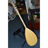 A UNBRANDED TURKISH LONG NECKED BAGLAMA with bowl back, fretwork sound hole to top edge, ebony