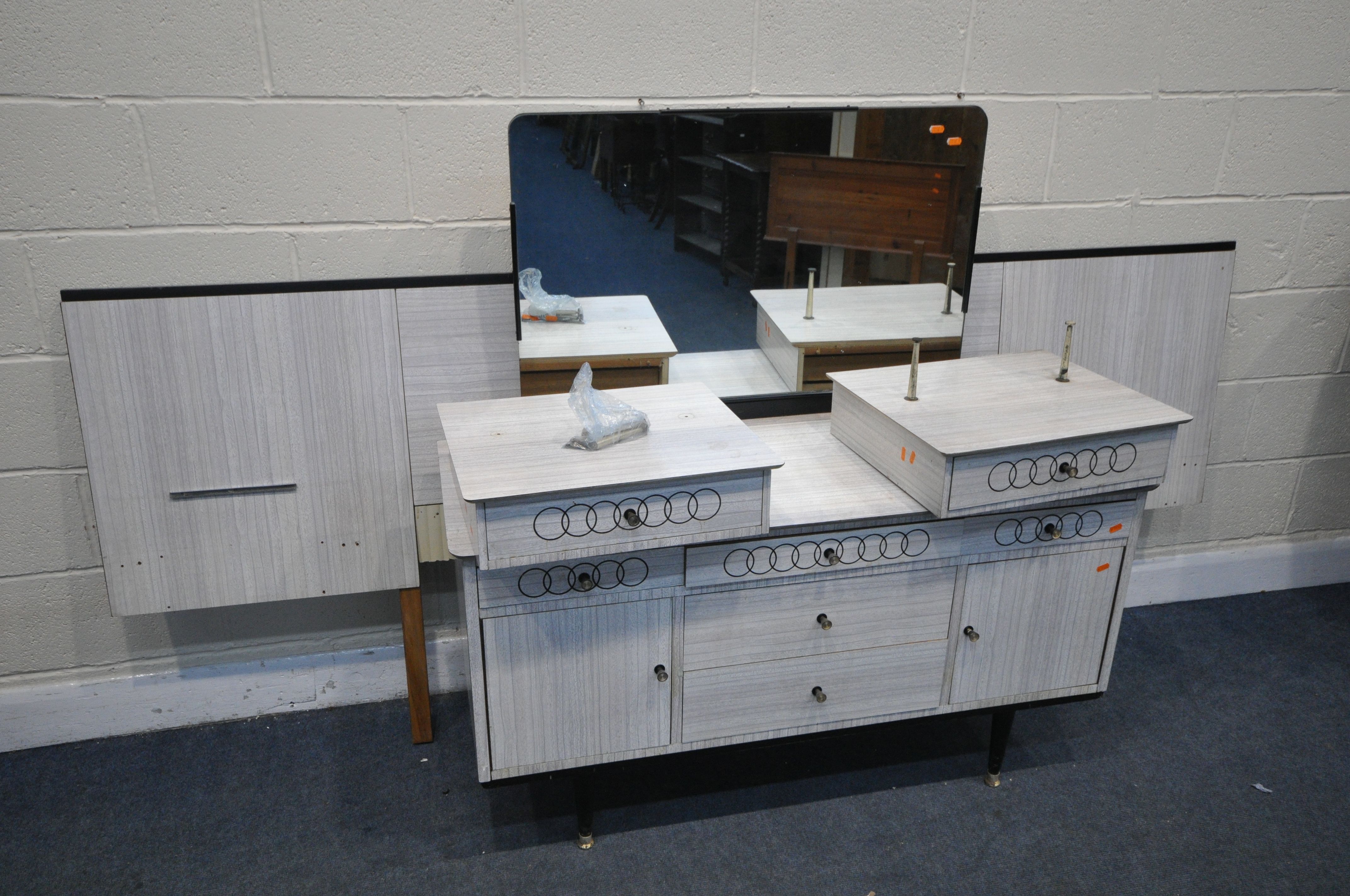 A MID CENTURY FORMICA BEDROOM SUITE, comprising a dressing table with a single mirror, and a