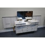 A MID CENTURY FORMICA BEDROOM SUITE, comprising a dressing table with a single mirror, and a