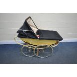 A VINTAGE MANTON CREAM FINISH PRAM (condition:-distressed and broken straps