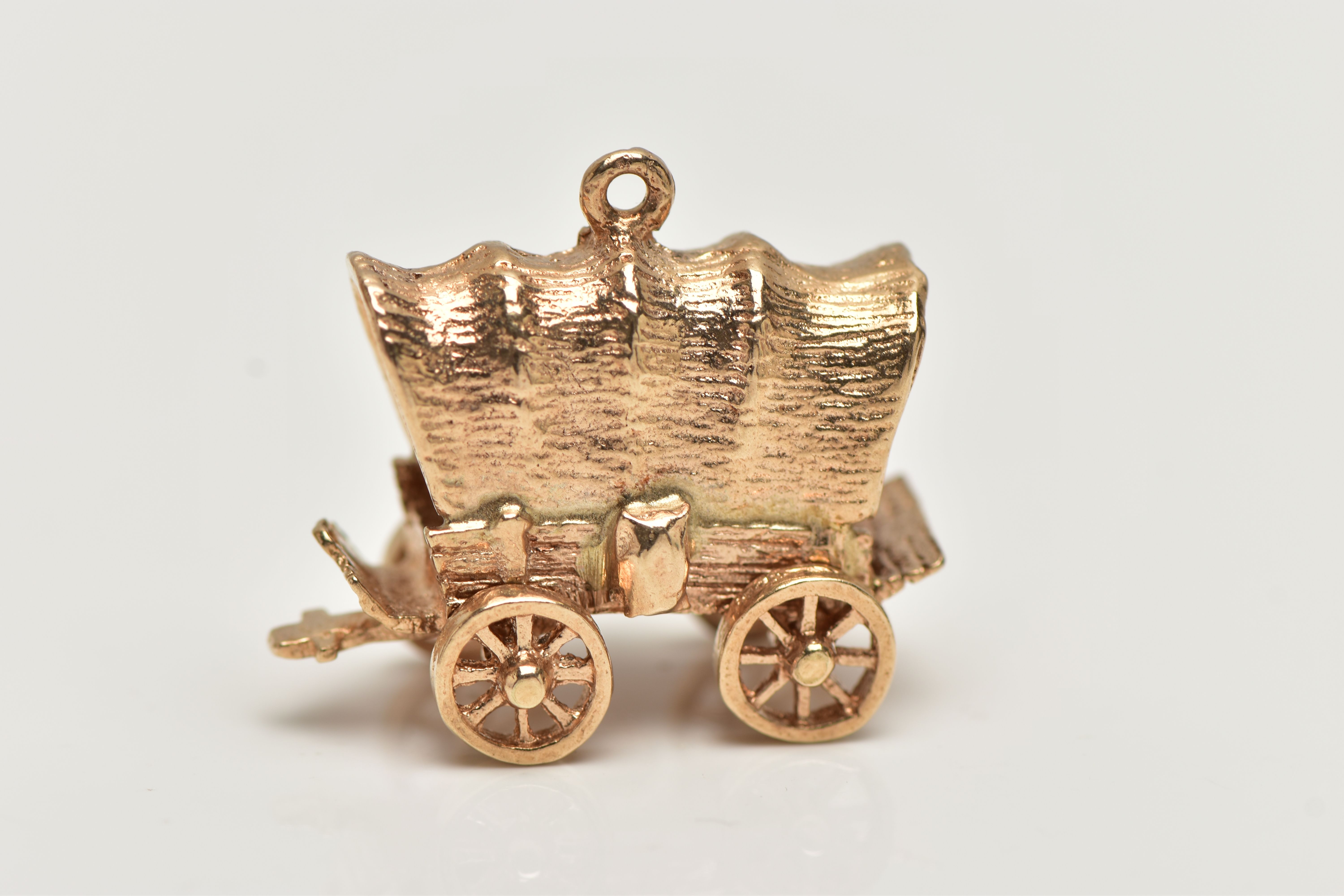 A 9CT GOLD CHARM, yellow gold charm of a wagon with moving wheels, hallmarked 9ct London,