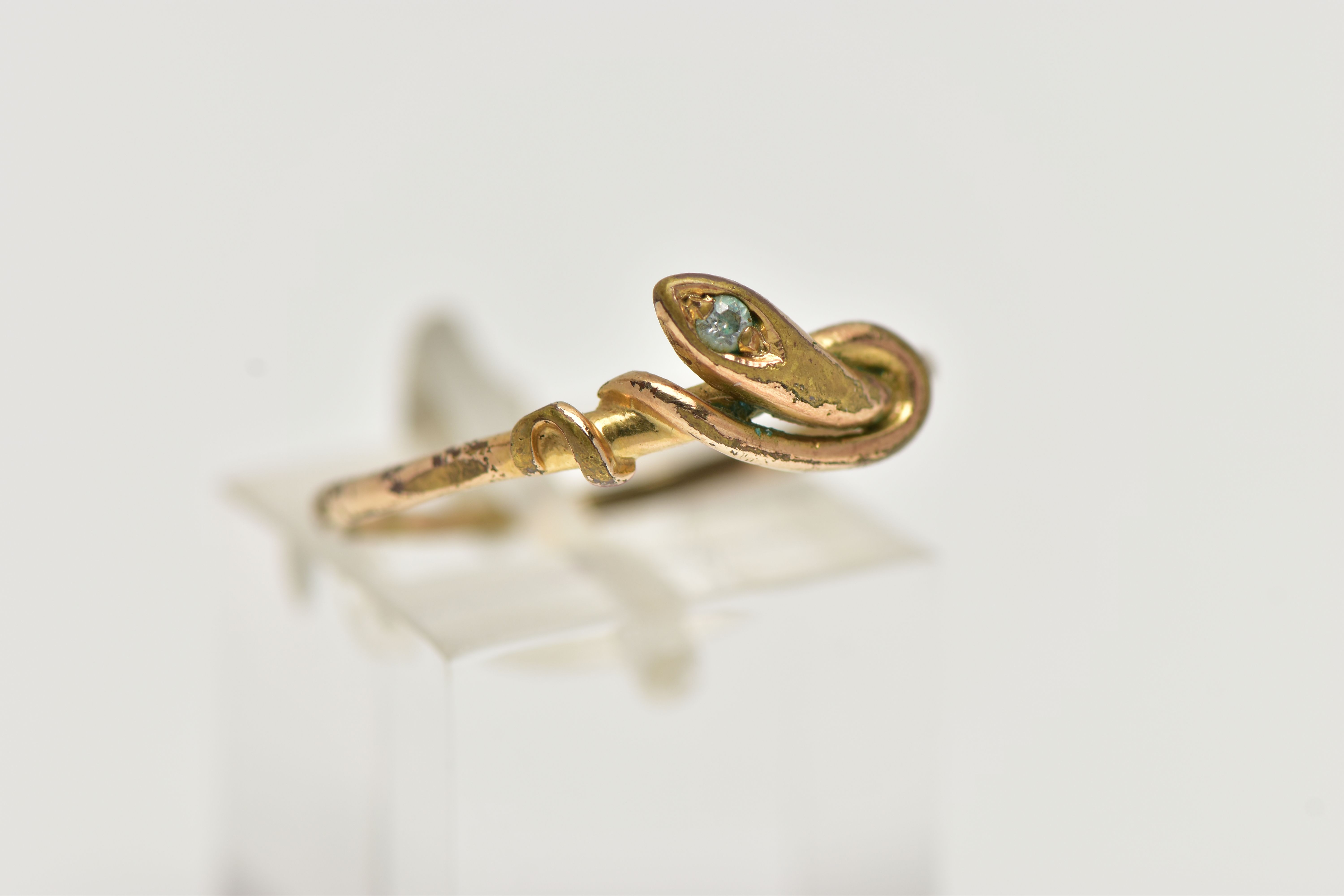 A GOLD PLATED SNAKE RING, coiled snake set with a colourless cubic zirconia to the head, unmarked, - Image 4 of 4