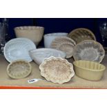 TEN CERAMIC JELLY MOULDS, of varied sizes and designs, to include late Victorian/Edwardian and later