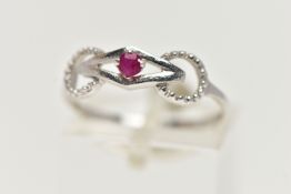 A 9CT WHITE GOLD RUBY RING, designed with a claw set, circular cut ruby, in an openwork mount
