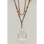 AN EARLY 20TH CENTURY ROCK CRYSTAL PENDANT, TOGETHER WITH A VICTORIAN CHAIN, the faceted rock